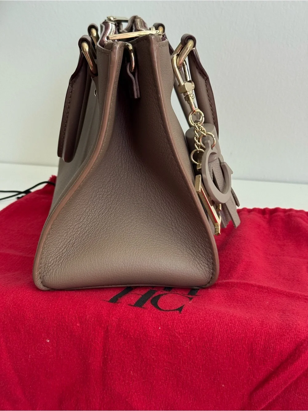 Carolina Herrera Elegant Brown Leather Top-Handle Handbag with Tassel Charm